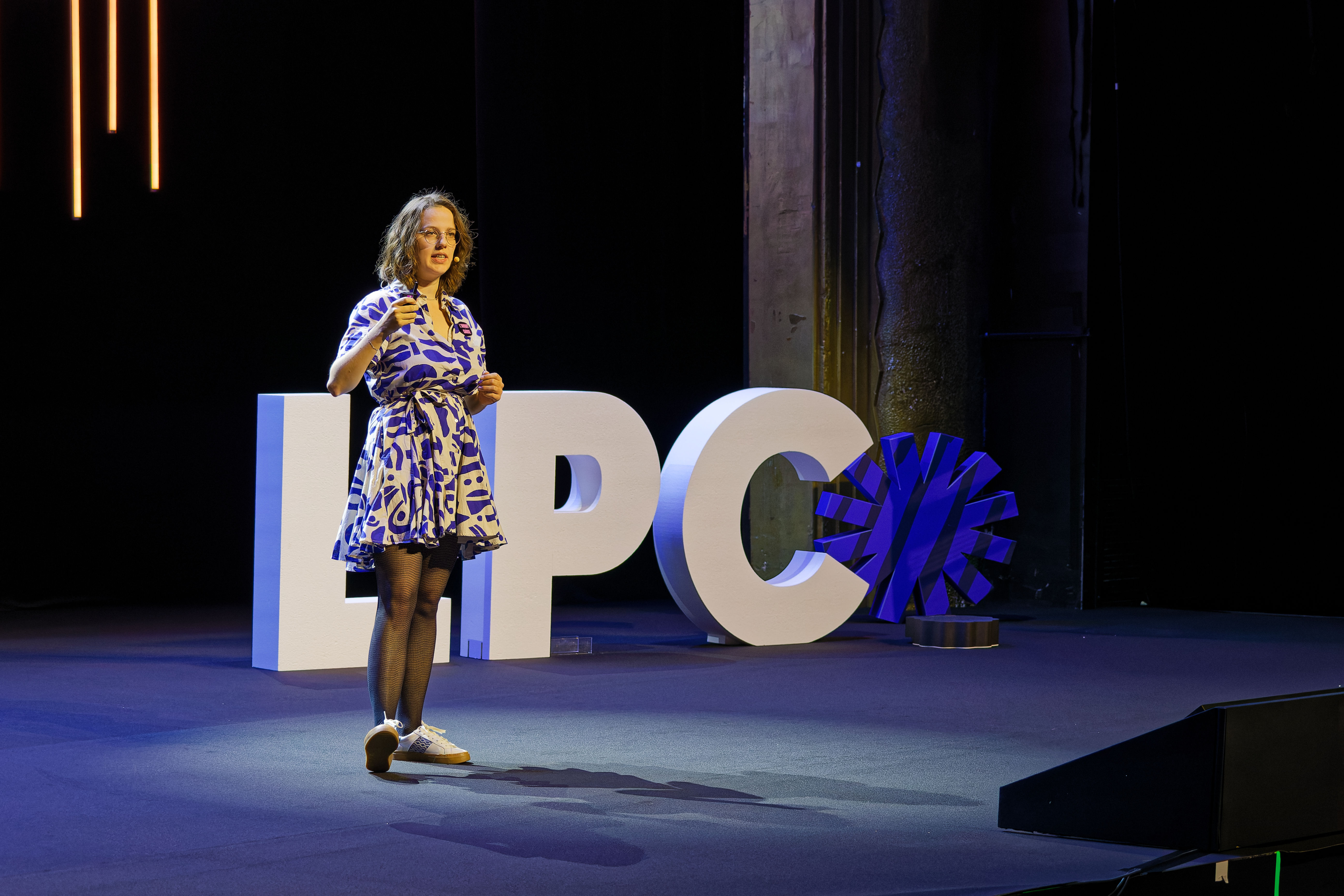 Claire Van de Voorde speaking on the main stage about prototyping at scale